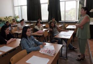учители